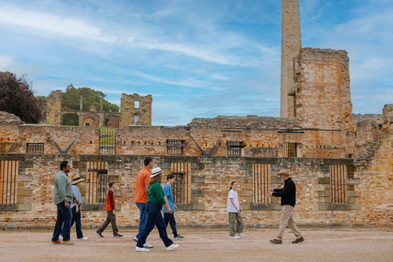 Tour group walking through convict-era ruins